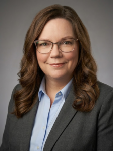 Maria_Dale_Author Maria Dale, professional chef and author, smiling in a kitchen setting.